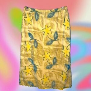 Yellow and teal floral double lines knee length skirt. Lettuce trim hem. Medium